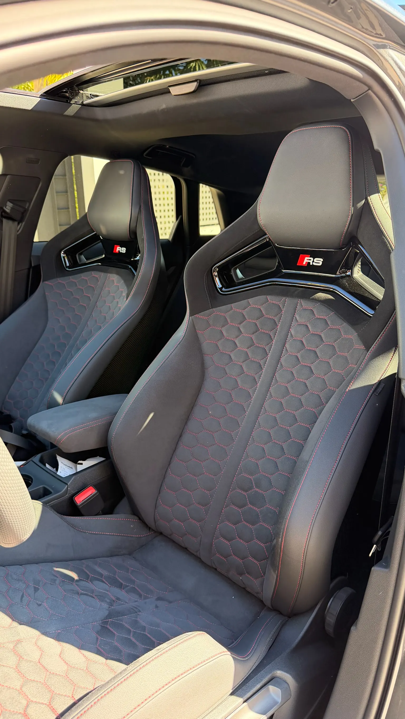 Audi RS3 RS sport seats in leather and Alcantara with red honeycomb stitching and illuminated RS badge